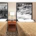 Super 8 by Wyndham Miles City room with two double beds and bedside lamp