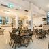 Hotel Diana Woolloongabba in Brisbane dining area with tables, chairs, and a bar counter