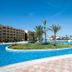 Nour Palace Resort And Thalasso in Mahdia with large outdoor pool, palm island and sea view