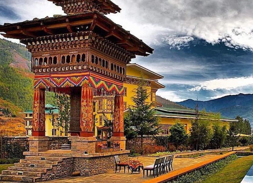 Pemako Thimphu with traditional Bhutanese pavilion, mountain backdrop, and landscaped grounds
