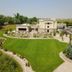 Hampton Inn & Suites Buffalo with landscaped lawn and parking lot in Buffalo