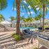 Hotel Cabana Clearwater Beach in Clearwater Beach poolside patio with palm trees, lounge chairs, and umbrella seating