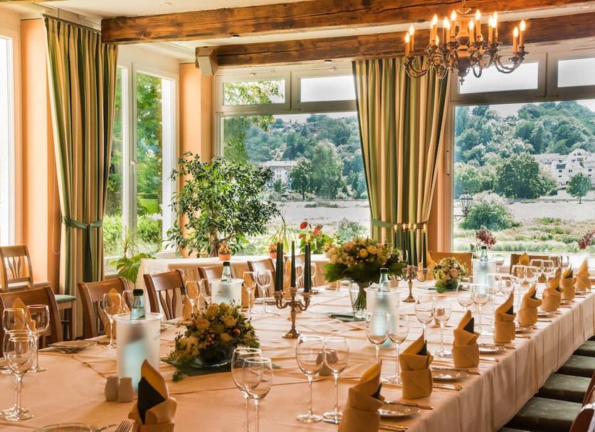 Hotel Knorre in Meissen dining room with set banquet table and river valley views