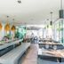 Novotel Lens Noyelles in Noyelles-Godault dining area with long communal table and hanging pendant lights