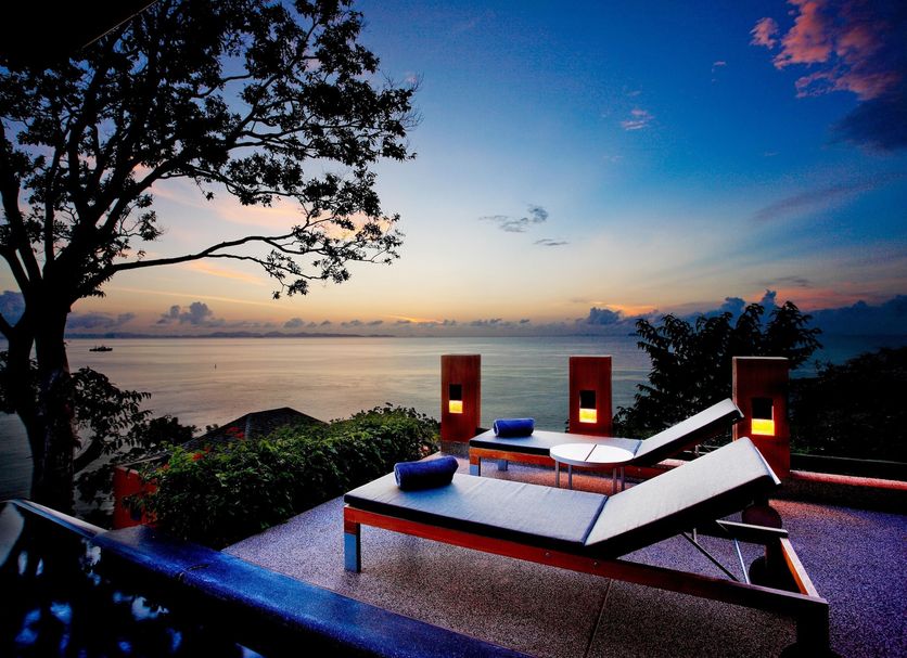 Sri Panwa Phuket Luxury Pool Villa Hotel in Wichit with sunset sea view and lounge chairs