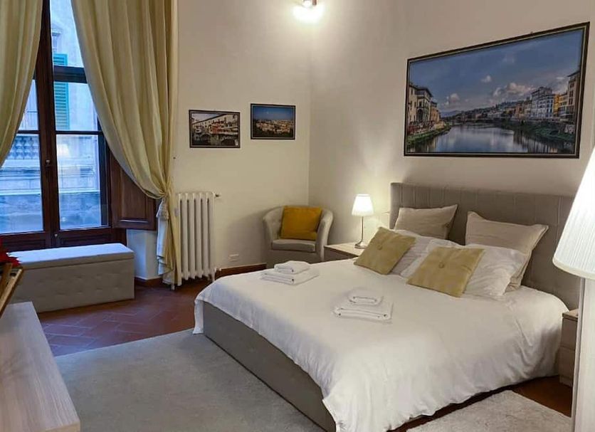 Coco Places Soggiorno Panerai in Florence, cozy guest room with double bed and city-view window