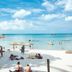 Zazen Boutique Resort & Spa in Ko Samui: white-sand beach with clear turquoise water and swimmers