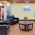 Days Inn by Wyndham Marietta-Atlanta-Delk Road lobby with black chairs, coffee table and vending machine