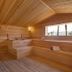 Royal Teos Thermal Resort Clinic & Spa sauna with wooden benches and wood-paneled walls in Seferihisar