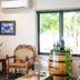 Hawkesbury Race Club Motel in Windsor: lounge with ornate chairs, horse artwork and window view