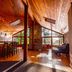 The Cabins at Terrace Beach in Ucluelet, wood-paneled lodge interior with bar and large windows