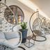 Romantik Hotel Hirschen in Parsberg: stylish indoor lounge with hanging egg chairs and windows