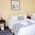 Hotel Rondó in Viña del Mar: guest room with two twin beds, bedside lamps, and window drapes