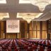 Shangri-La Baotou ballroom with rows of red chairs and chandeliers in Baotou