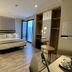 abba Sevilla guest room with king bed, open wardrobe, desk and balcony door in Seville