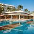Premier Residences Phu Quoc Emerald Bay Managed by Accor poolside resort with large turquoise pool and palm trees in Phu Quoc