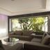 Christofinia Hotel in Ayia Napa lounge with sectional sofas and large window to tropical greenery