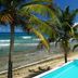 Bravo Beach Hotel in Vieques with beachfront pool, palm trees, and ocean views