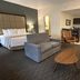 Best Western Plus Chihuahua Juventud room with bed, sofa, coffee table and kitchenette in Chihuahua