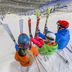 Hotel Fire & Ice Düsseldorf/Neuss in Neuss ski area with guests seated on a snowy slope holding skis