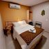 Pousada Recanto room in Fernando de Noronha with double bed, wall AC, and bedside table