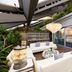 Hotel Eclat Beijing, an SLH Hotel in Beijing with stylish lounge seating and glass-walled terrace