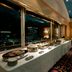 Hotel Nikko Tsukuba buffet table by large windows with nighttime city view in Tsukuba