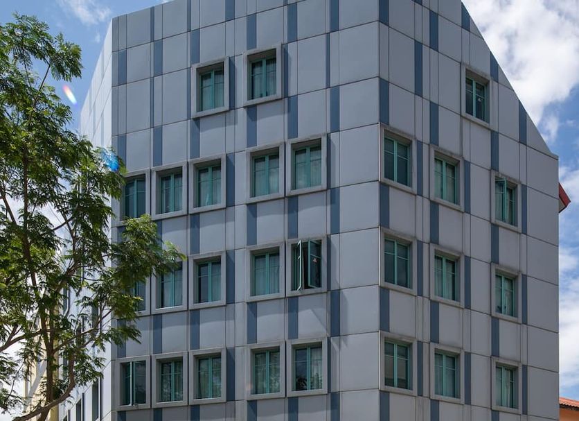 The Quay Hotel West Coast in Singapore, modern multi-story hotel exterior with grid-patterned windows