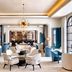 Sofitel Shanghai North Bund lobby lounge with blue chairs, white seating and a starburst chandelier