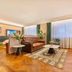 James Joyce Coffetel Hotel Qinhuangdao lobby lounge with sofa, chairs and large windows