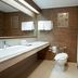 Centara Life Hotel Mae Sot bathroom with sink, toilet, mirror, and walk-in shower