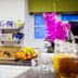 Breakfast buffet at Kingsland Hotel in London with pastries, cereal, fruit, and drinks on a counter