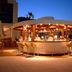 Ideal Pearl Hotel Adults Only in Marmaris: illuminated rooftop bar with stools at dusk