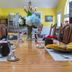 Yellow House B&B in Salado dining room set for a meal with a long wooden table and yellow walls