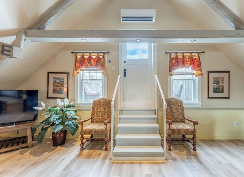 Dominion Hill Country Inn in Bocabec attic lounge with central staircase and seating