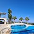 Oasis Scaleta Hotel in Skaleta with outdoor pool, palm trees and sea views