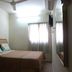 Skudai Baru Hotel in Skudai: simple guest room with double bed, ceiling fan, window and wall-mounted TV