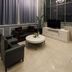 Hotel Pharos Seoul lobby lounge with chandelier, black seating, TV, and floor-to-ceiling windows