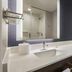 Residence Inn By Marriott New York Jfk Airport bathroom vanity with sink and mirror in Queens