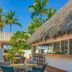 Melia Habana Havana poolside thatched bar with palm trees and outdoor seating