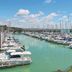 ibis Granville Port de Plaisance in Granville overlooking a marina with sailboats and turquoise water