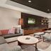 Courtyard by Marriott San Jose South/Morgan Hill lobby lounge with sofa seating and TV
