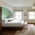 The Stavrand Russian River Valley room in Guerneville with a king bed, bench, windows and patterned rug