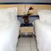 La Defense Apart Hotel in Montes Claros: twin beds with bedside table and flower arrangement