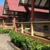 D.R. Lanta Bay Resort in Ko Lanta with bungalows lining a walkway and lush tropical greenery