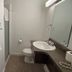 Lake-Vu Motel Kenora bathroom with sink, toilet, shower and towel rack