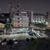 Night view from The Park Residence, Bangkok, showing city buildings and parked cars