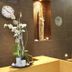 Alegria Plaza Paris in Lloret de Mar lobby with dark tile walls, lit stairs and orchid display