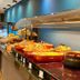 Minas Garden Hotel in Poços de Caldas breakfast buffet with pastries and fruit on a serving counter