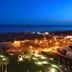 Eurotel Altura in Castro Marim with oceanfront night view, lit gardens, and a tennis court